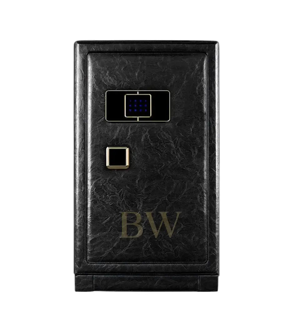 Black leather watch winder safe with gold accents on a white background