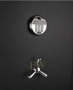 Black safe with digital keypad and traditional lock on a black background