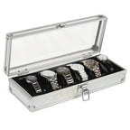Silver watch box with six luxury watches inside on a white background