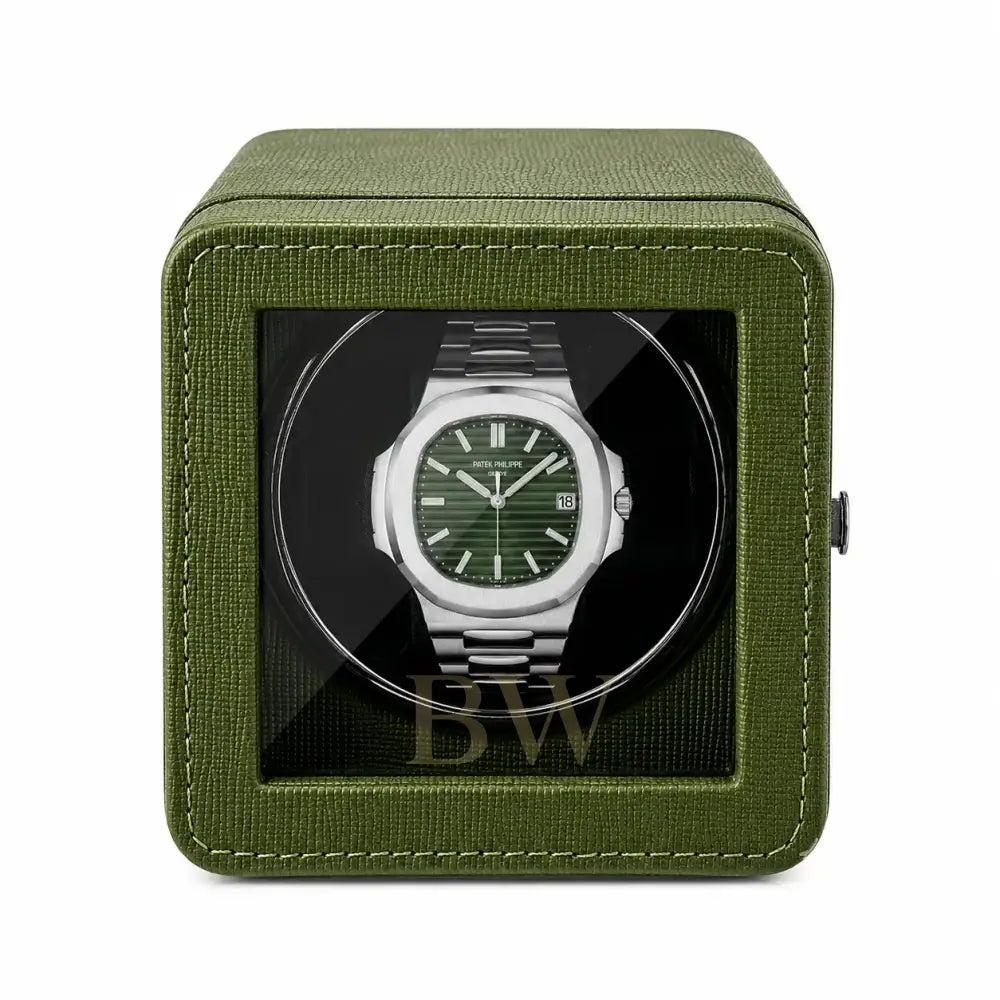 Patek Philippe Watch in a green watch winder case on a white background