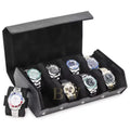 A black watch roll box with 8 cushioned slots holding multiple luxury watches, plus one watch displayed on a small matching stand in front.