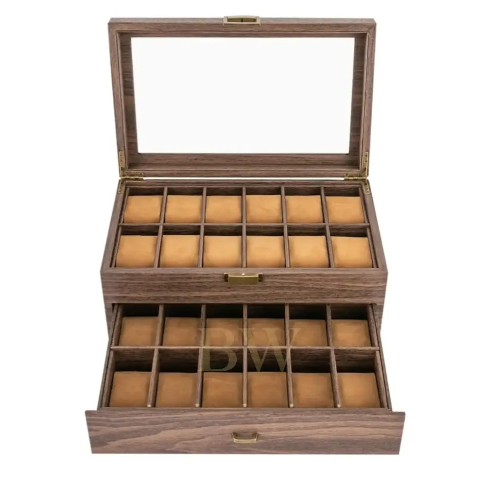 A wooden watch box with a glass lid, shown open to reveal two tiers of watch slots lined with tan velvet. The box has a dark brown wood grain finish with brass-tone metal hardware.