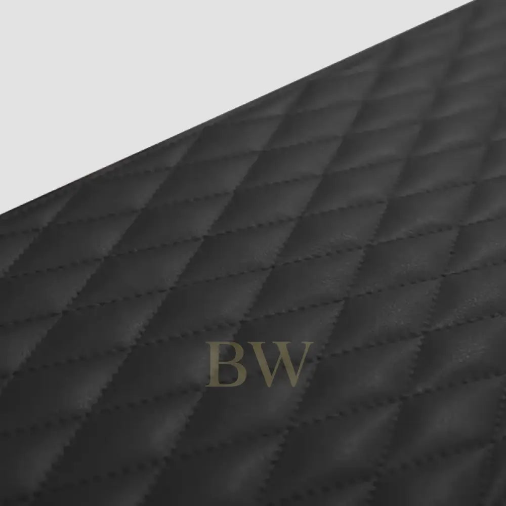 Close-up of a black quilted fabric texture of watch winder 