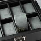 Gray ring on gray felt in a black jewelry box