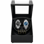 Two luxury watches in a black leather watch winder box.