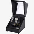 Black watch winder with two watches inside on a white background