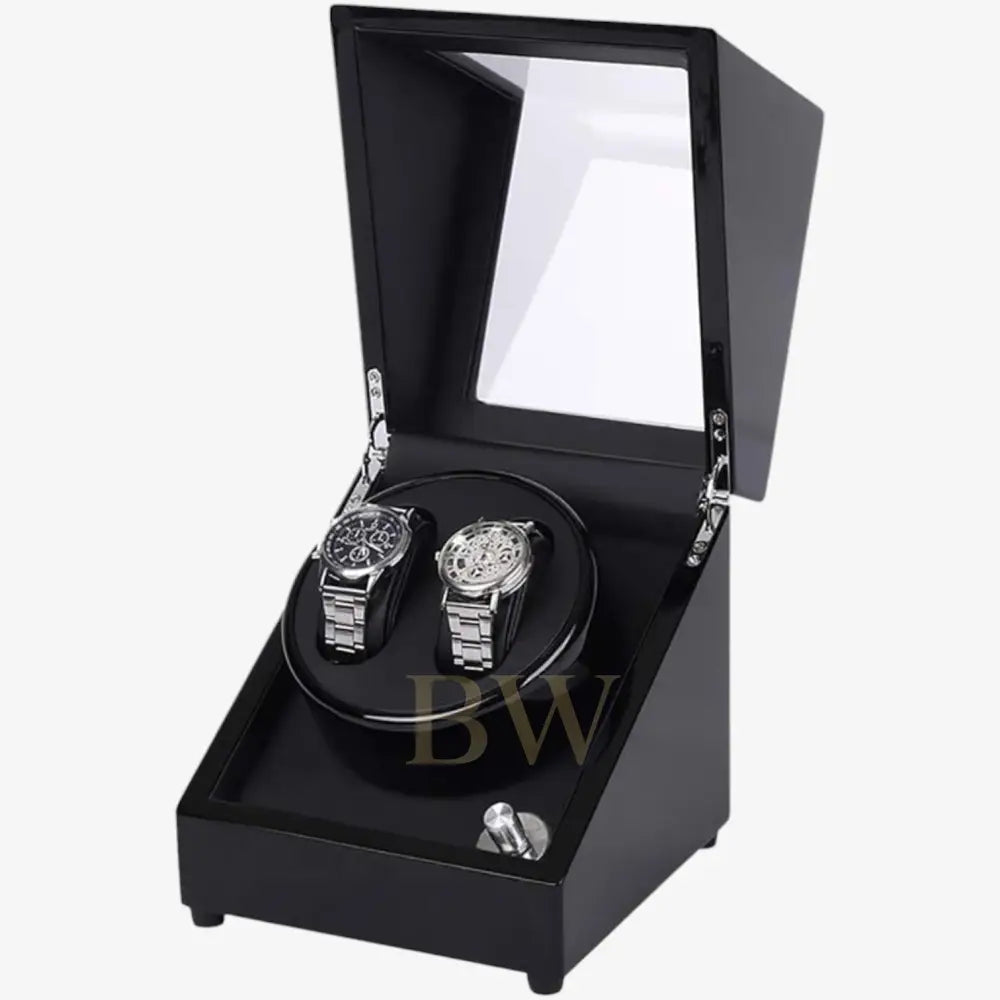 Black watch winder with two watches inside on a white background