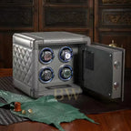 grey leather watch winder with four rotating watches on a wooden surface.