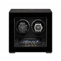 Black watch winder with two luxury watches inside : Patek Philippe and Audemars Piguet.