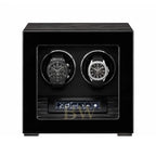Black watch winder with two luxury watches inside : Patek Philippe and Audemars Piguet.