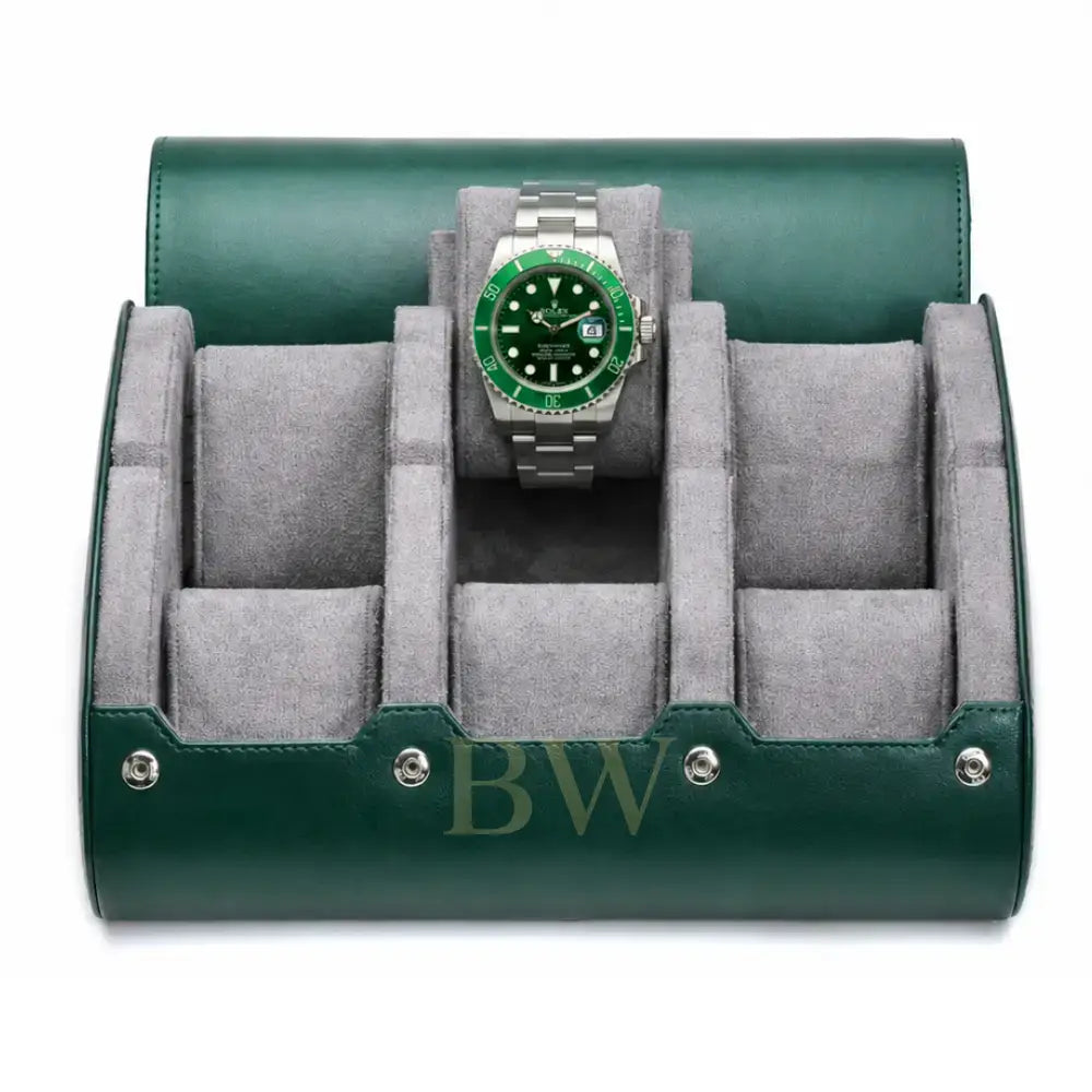 A green leather watch roll stand with a gray velvet interior, shown open and holding a Rolex Hulk watch with a green dial and bezel.