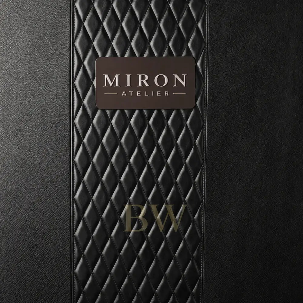 Black textured surface with a 'Miron Atelier' label