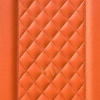 Close-up of orange quilted leather texture