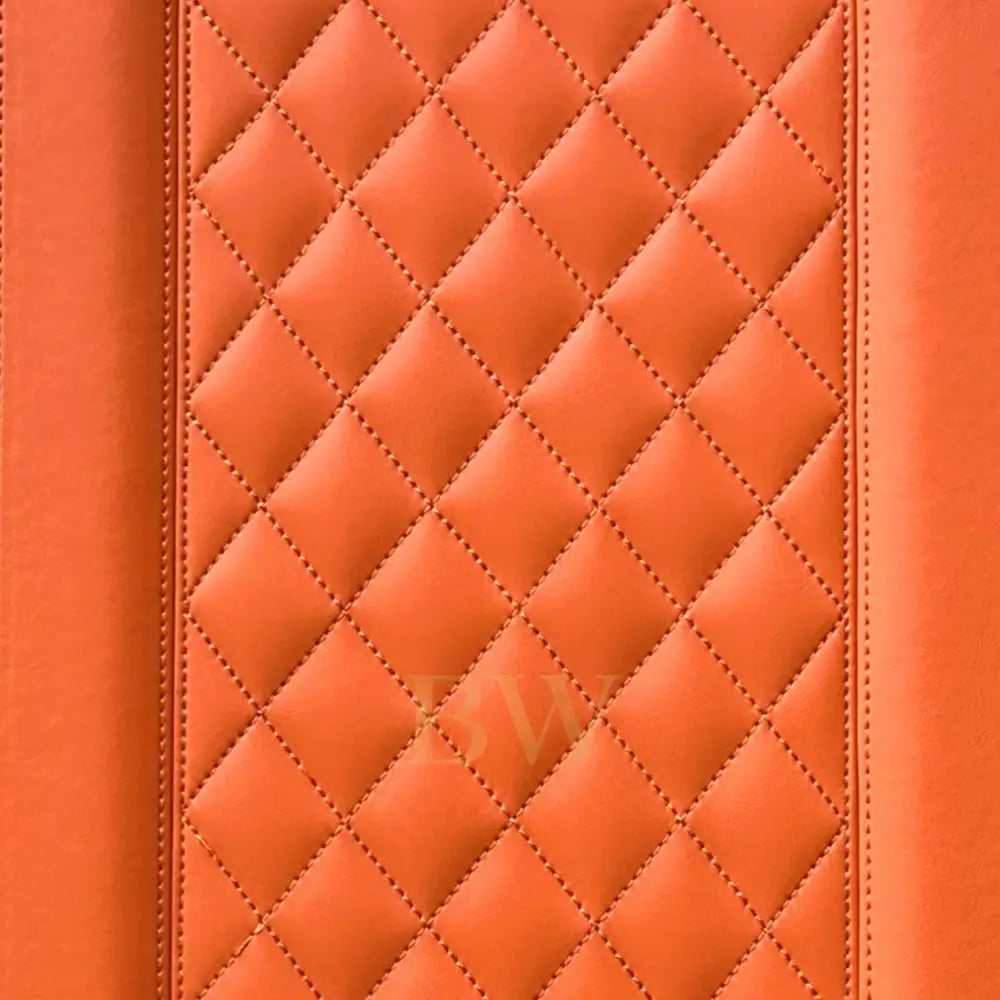 Close-up of orange quilted leather texture