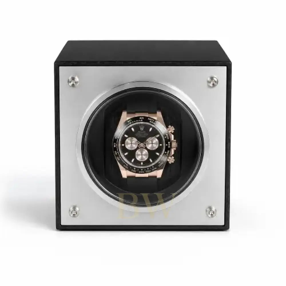 Watch winder with a black and rose gold Rolex Daytona watch inside on a white background