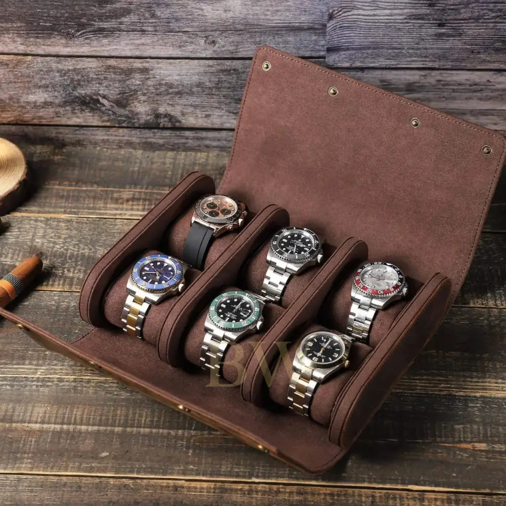 A brown leather watch roll with six slots holding six watches, photographed on a rustic wooden tabletop.