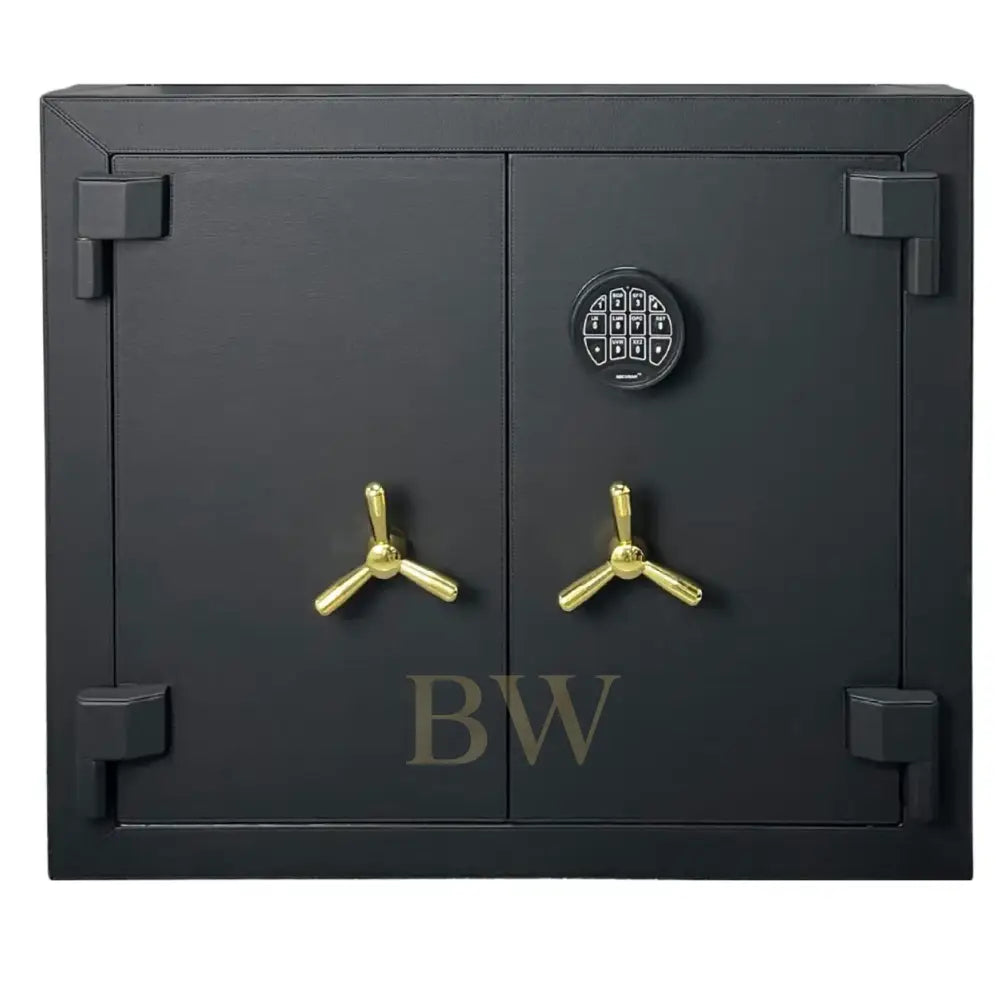 Black safe with gold handles on a white background