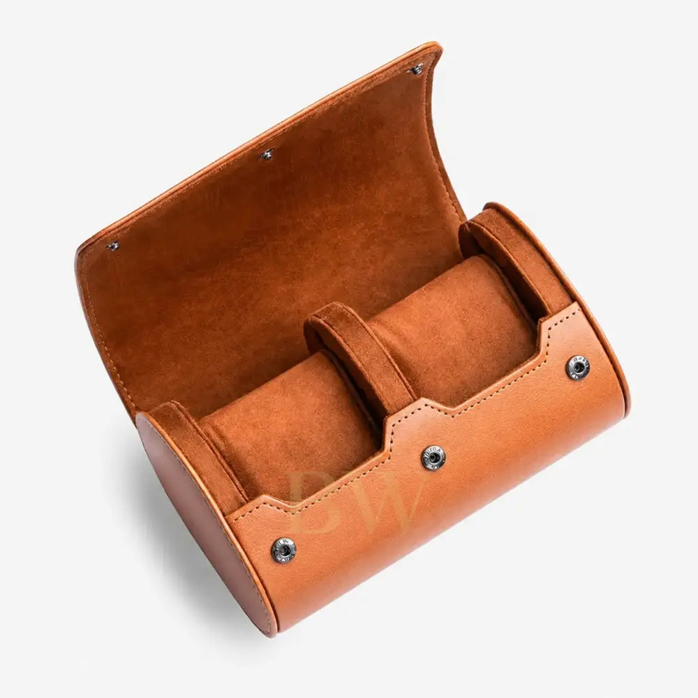 Brown leather watch roll with two compartments on a white background