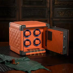 Orange watch winder with open door on a wooden surface