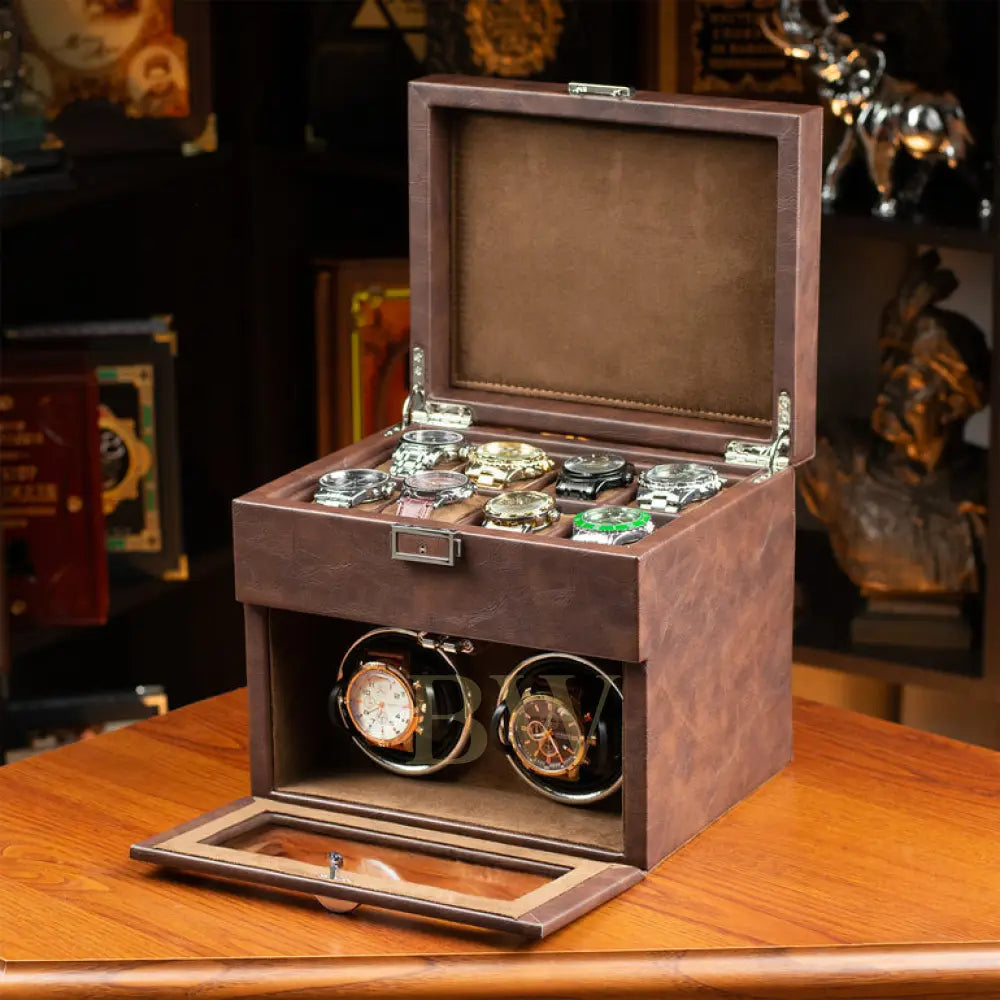 Wooden watch box with two watches inside on a wooden surface.