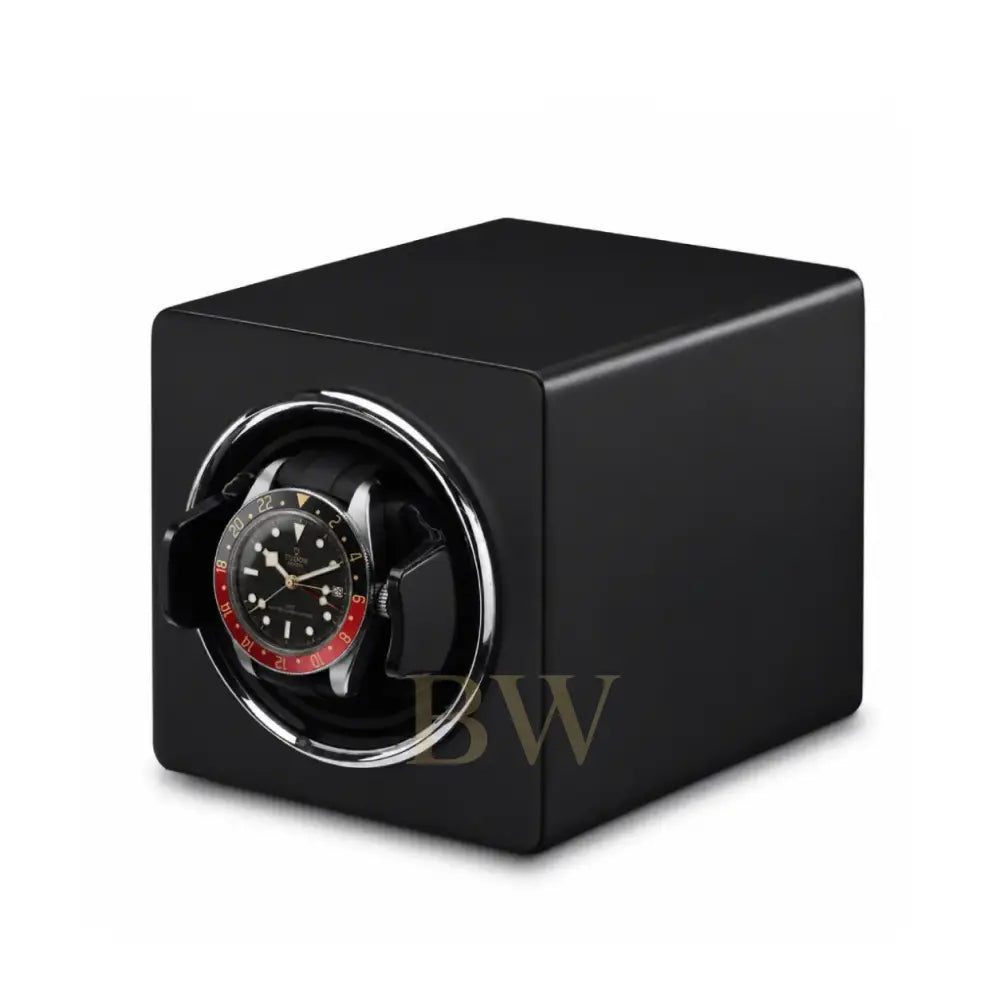 Black matte watch winder with a Tudor watch inside on a white background