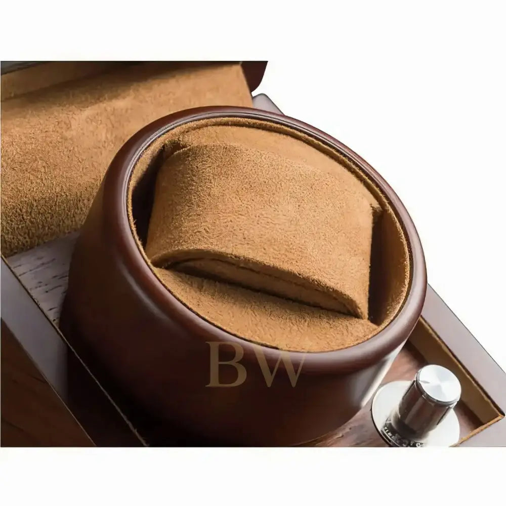 Close-up of a brown leather watch winder in a white background