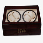 Wooden watch winder box with two compartments for watches inside.