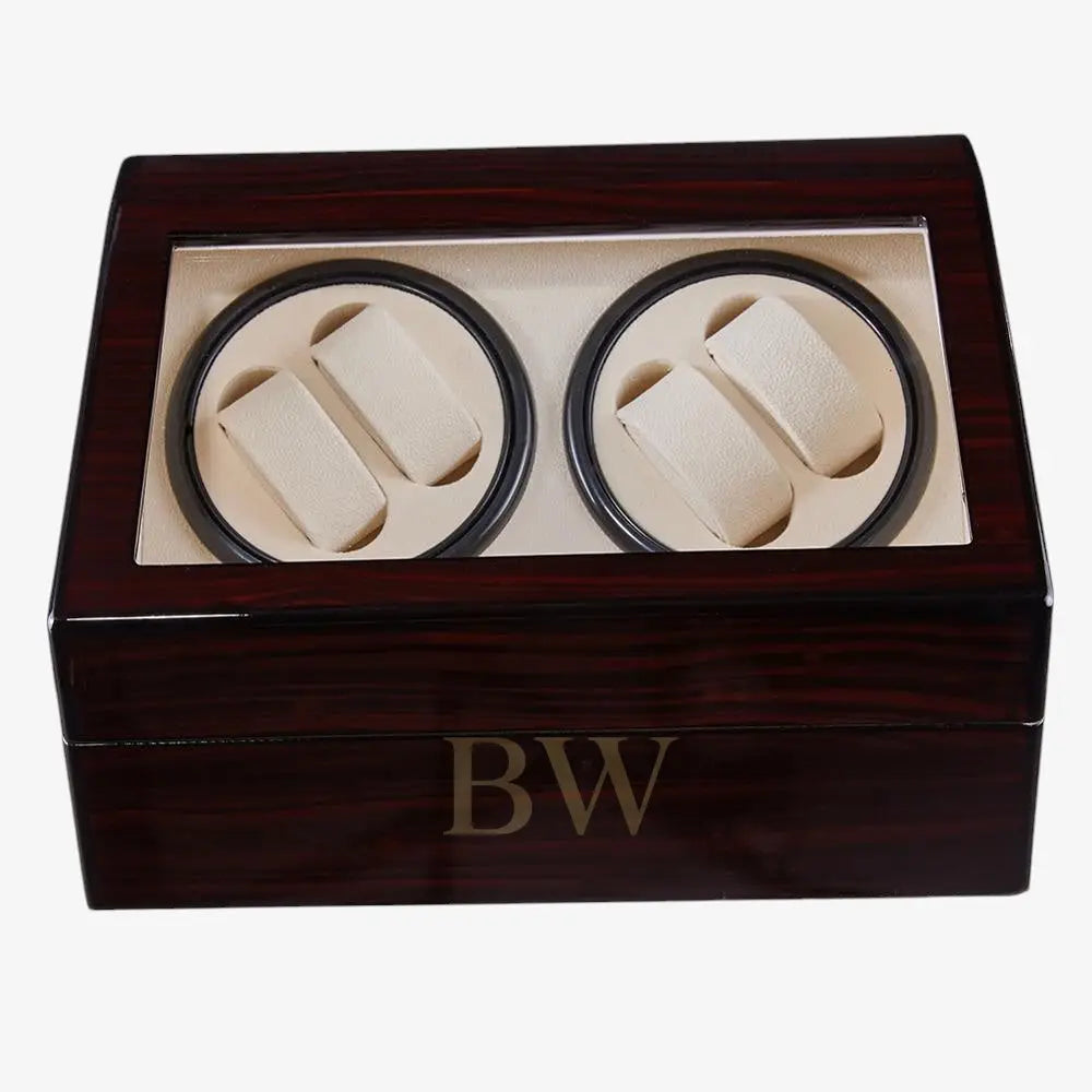Wooden watch winder box with two compartments for watches inside.