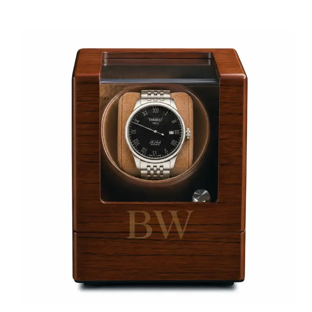 Wooden watch winder with a Tissot watch inside on a white background